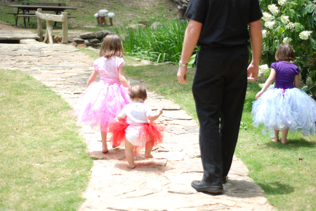 Daddy and girls walking